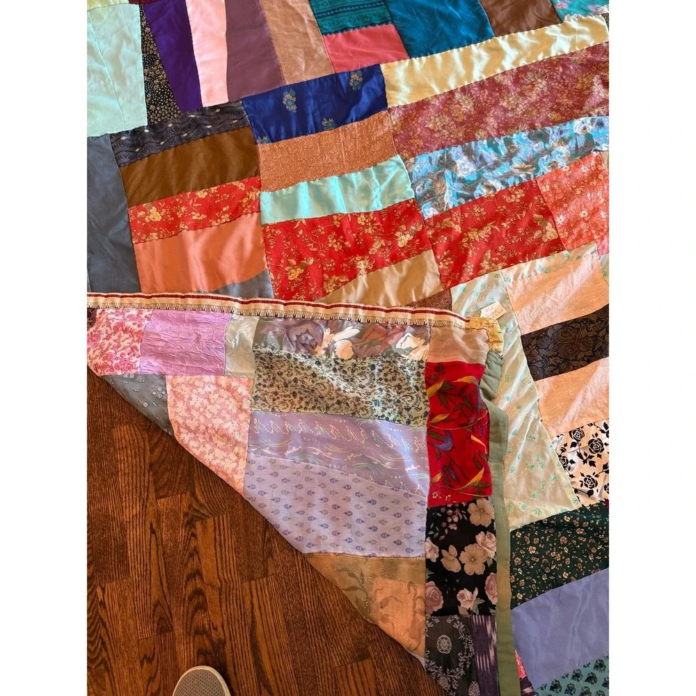 Old crazy Quilt. Patchwork silky fabrics